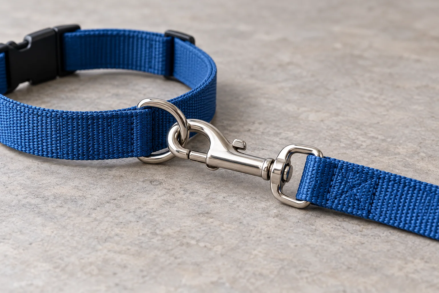 Closed leash clip attached to the designated metal collar walking ring